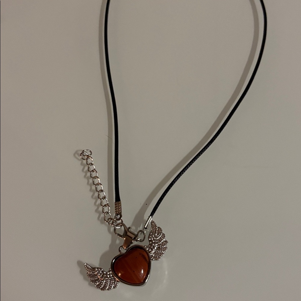 Red stone winged heart necklace